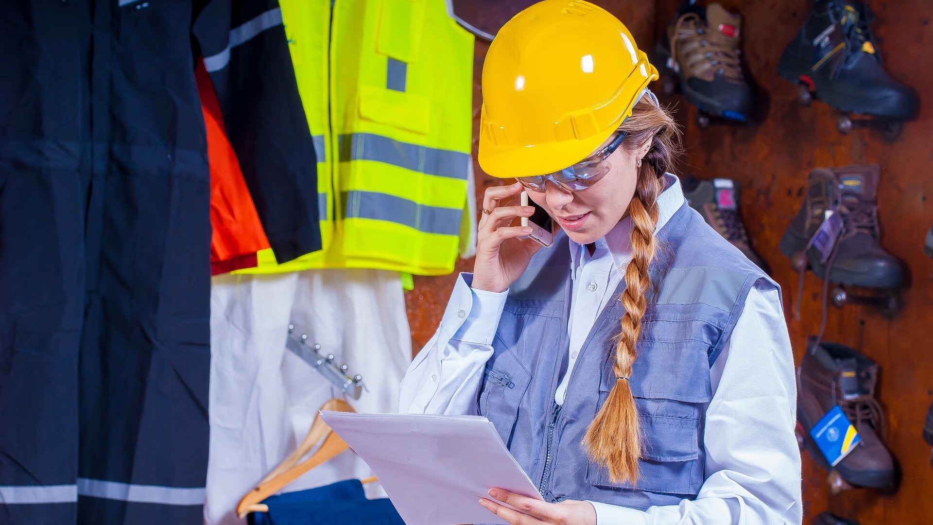 Woman in safety workwear carries out supplies audit